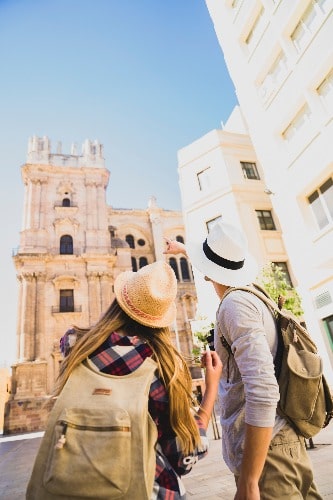 Couple in front of the Cathedral in Malaga